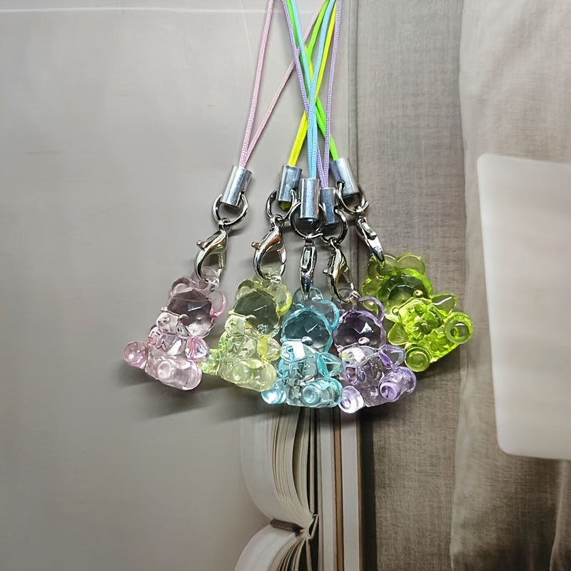 A Collection of 5 Adorable Clear Bear Mobile Phones, Keychains, And Backpack Charms.