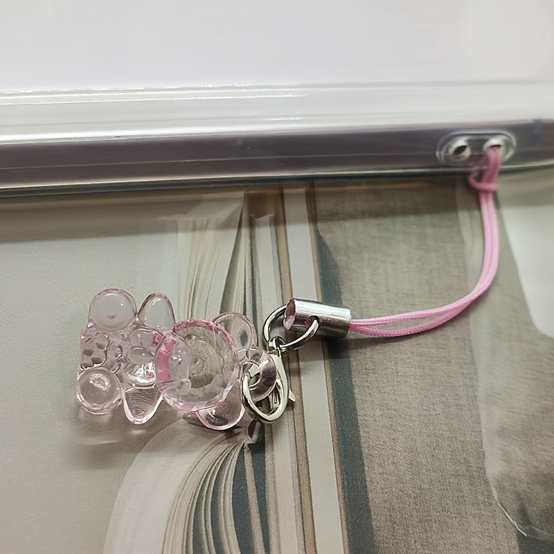 A Collection of 5 Adorable Clear Bear Mobile Phones, Keychains, And Backpack Charms.