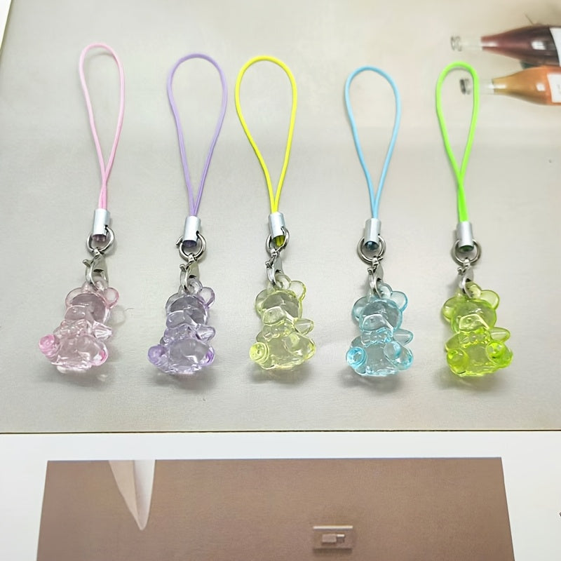 A Collection of 5 Adorable Clear Bear Mobile Phones, Keychains, And Backpack Charms.