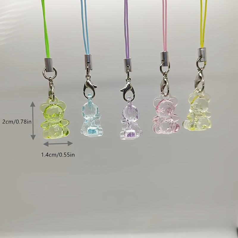 A Collection of 5 Adorable Clear Bear Mobile Phones, Keychains, And Backpack Charms.