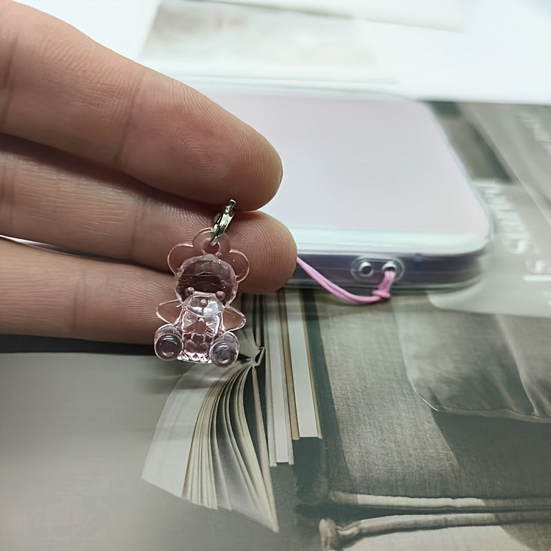 A Collection of 5 Adorable Clear Bear Mobile Phones, Keychains, And Backpack Charms.